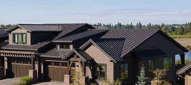 Dark bronze standing-seam metal roof on a craftsman-style home in Washington, NC